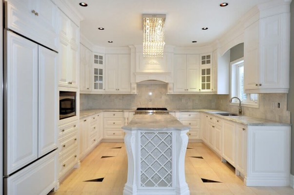 custom white kitchen with brown decor floor