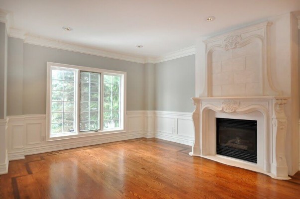 luxury living room with wooden floor and custom fire place