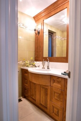 custom washroom with brown vanity