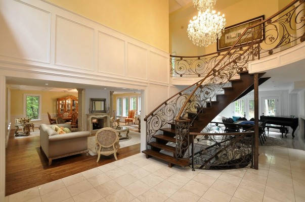 custom living room with staircase to second floor