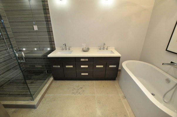 bathroom with shower , bathtub and brown vanity