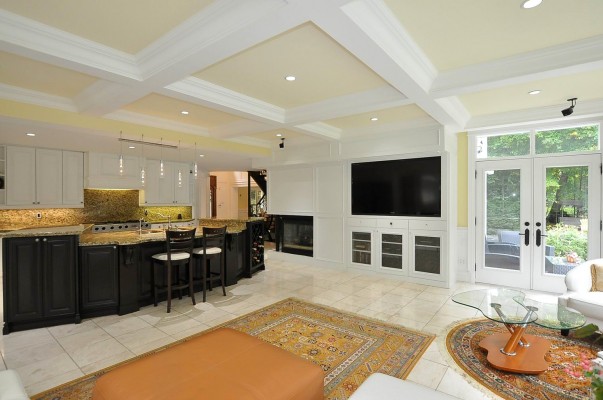 white living room and kitchen with black island